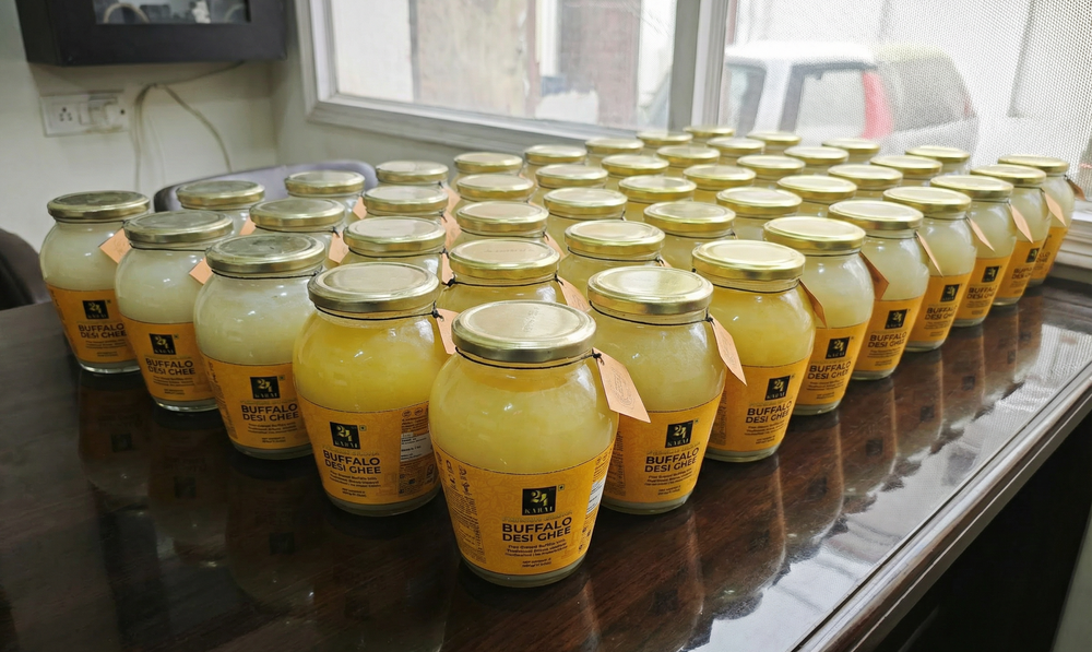 24 Karat Buffalo Ghee Jars on a Table